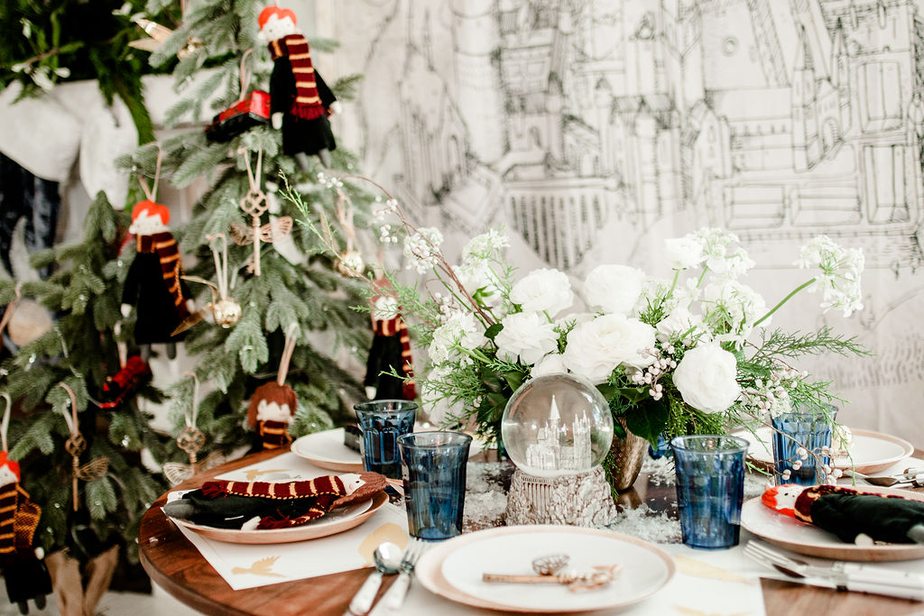 Create a wintry tablescape with white plates and napkins., How to Have the  Most Magical Harry Potter Christmas