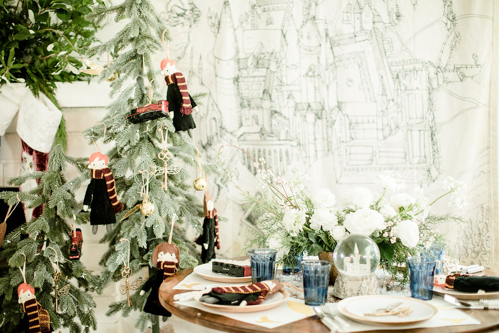 Create a wintry tablescape with white plates and napkins., How to Have the  Most Magical Harry Potter Christmas