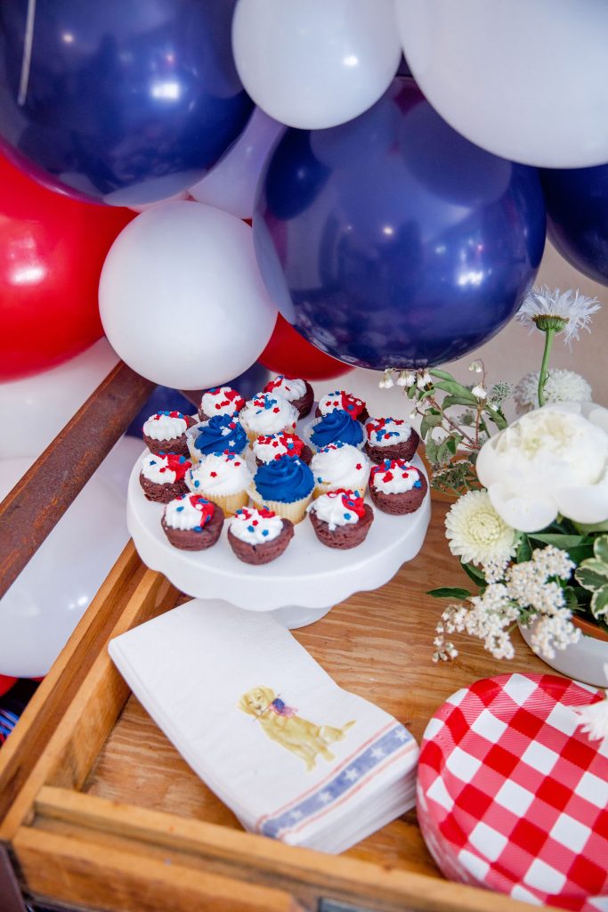 A red, white, and blue firework cake smash for a 4th of July baby